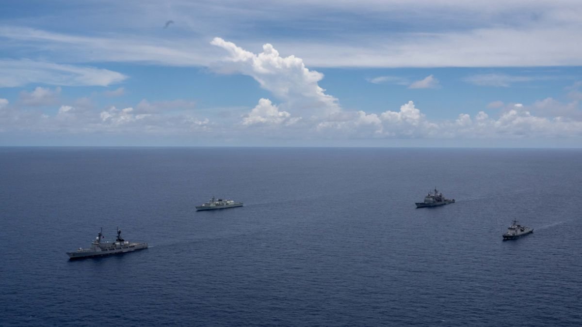 Naval vessels operating in formation during a multinational maritime exercise representing BRICS cooperation and evolving alliance architectures in the emerging multipolar order