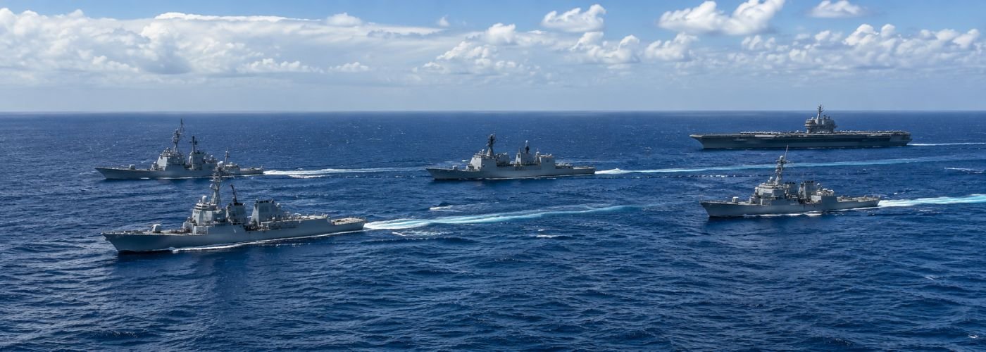 Naval fleet in formation at sea representing the Indo-Pacific military balance between the United States China and regional powers