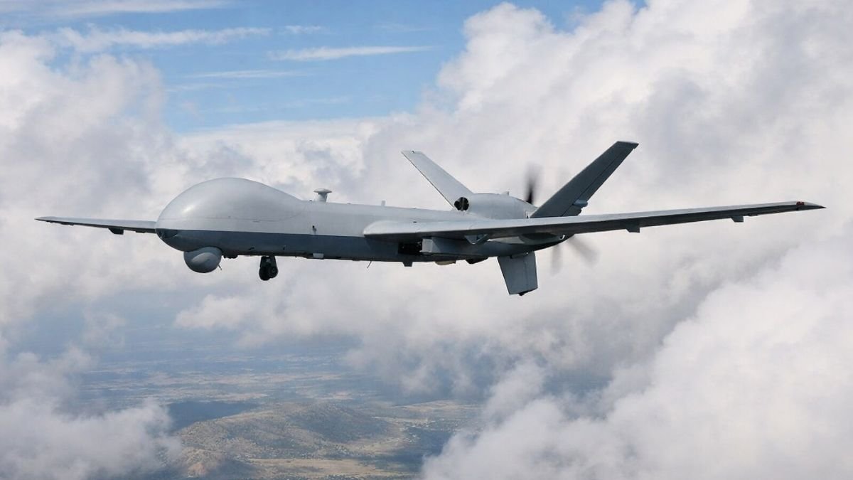 MQ-9 Reaper surveillance drone in flight over open terrain representing AI-enabled intelligence, surveillance, and reconnaissance applications in modern military operations