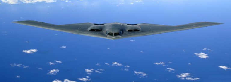 B-2 Spirit stealth bomber in flight representing precision strike weapons in modern warfare