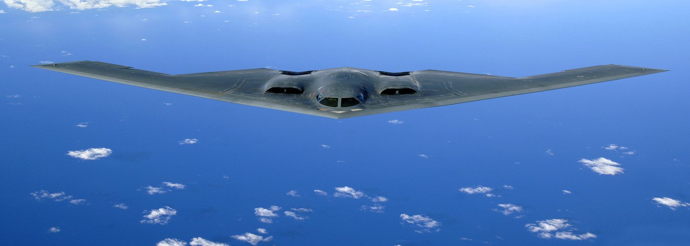 B-2 Spirit stealth bomber in flight representing precision strike weapons in modern warfare