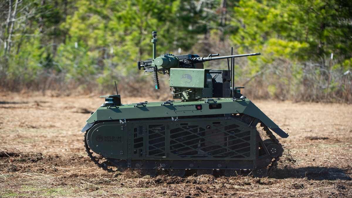 Small tracked unmanned ground vehicle representing uncrewed logistics and combat robots in modern conflict