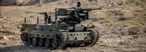 Military ground robot with a weapon system representing autonomous weapons and the ethics of lethal autonomy in modern warfare.