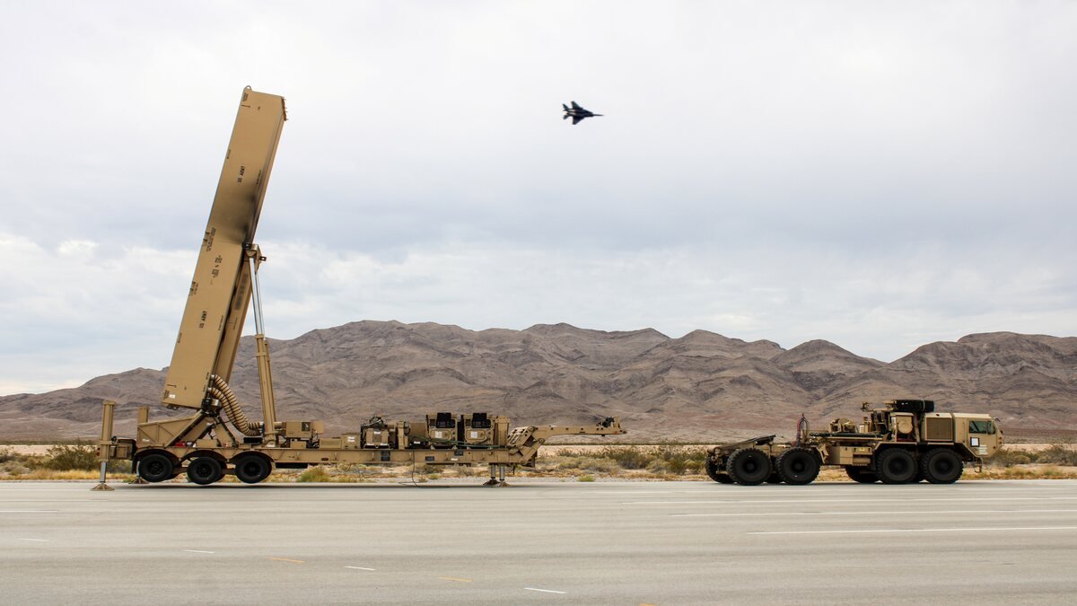 Dark Eagle hypersonic weapon transporter erector launcher with an Air Force F-16 during Exercise Bamboo Eagle